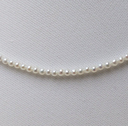 Baby 3mm white Akoya and freshwater pearl necklace with semi-round pearls and good luster
