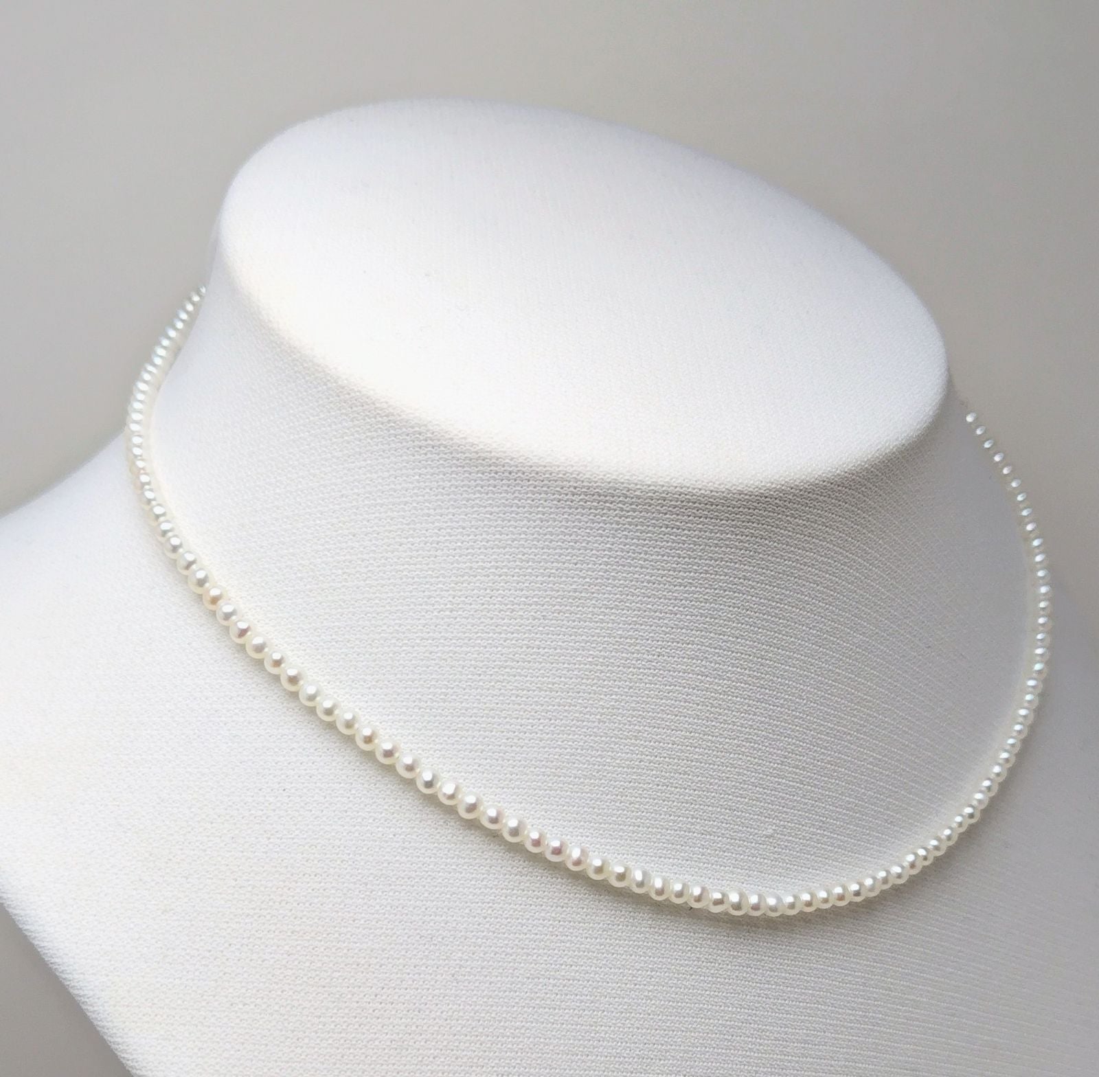 Baby 3mm white Akoya and freshwater pearl necklace with semi-round pearls and good luster
