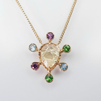 Agete K10 multi-color stone necklace model 24-4457 laid flat showing elegant design