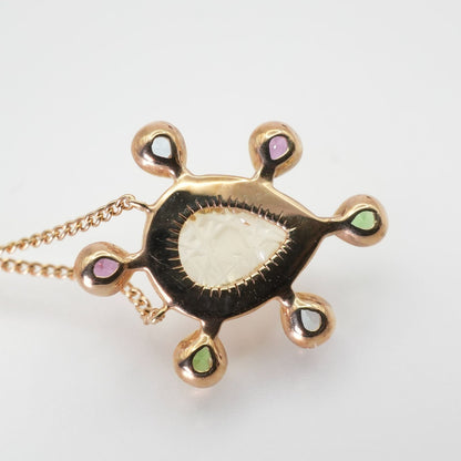 Agete K10 multi-color stone necklace model 24-4457 laid flat showing elegant design