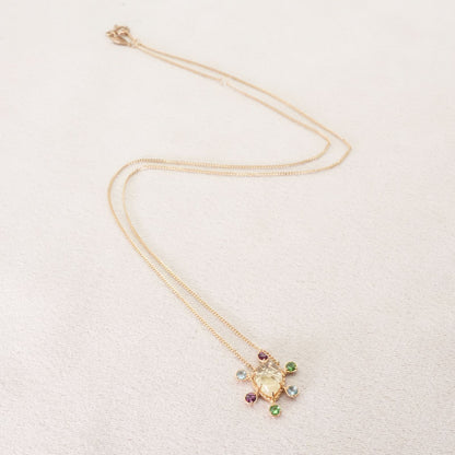 Agete K10 multi-color stone necklace model 24-4457 laid flat showing elegant design