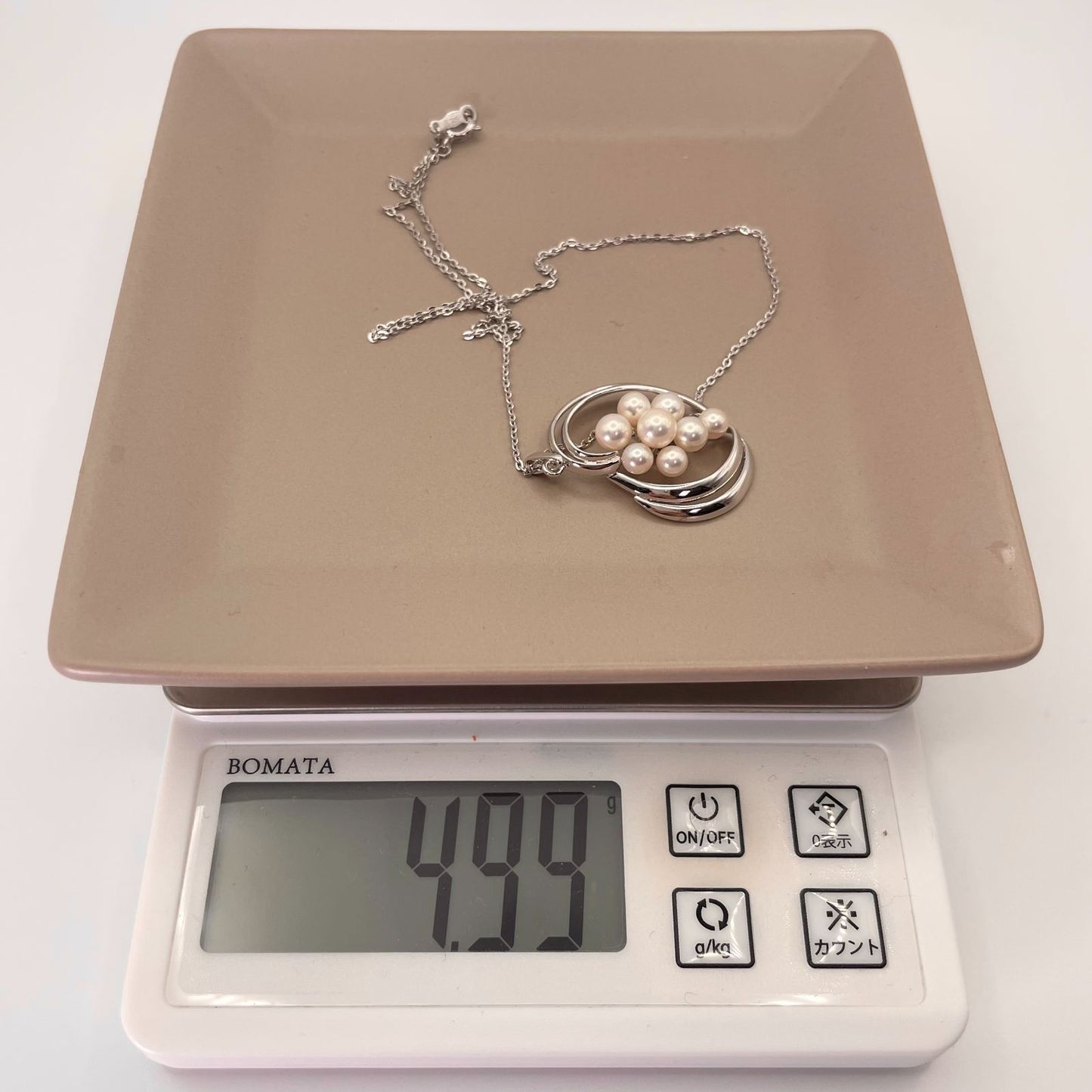Mikimoto Silver Akoya Pearl Pendant Necklace with a single white pearl on a silver chain