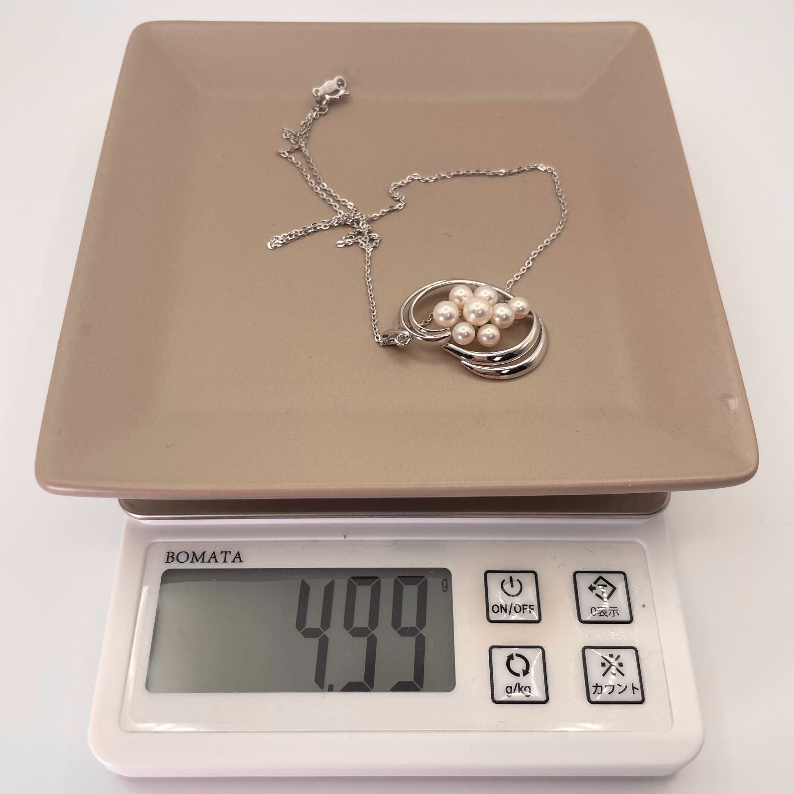 Mikimoto Silver Akoya Pearl Pendant Necklace with a single white pearl on a silver chain