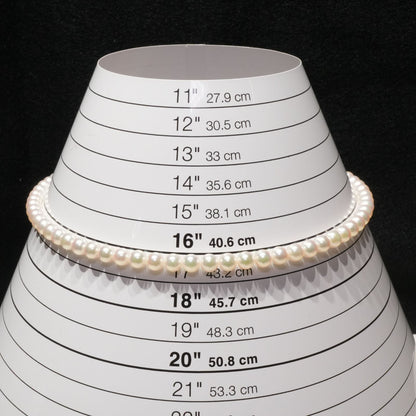 Mikimoto Akoya pearl necklace with 6.4mm pearls and silver current clasp on white background