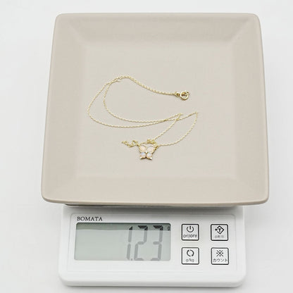 Agaat butterfly necklace with K14 gold, opal stone, and small diamond on delicate chain