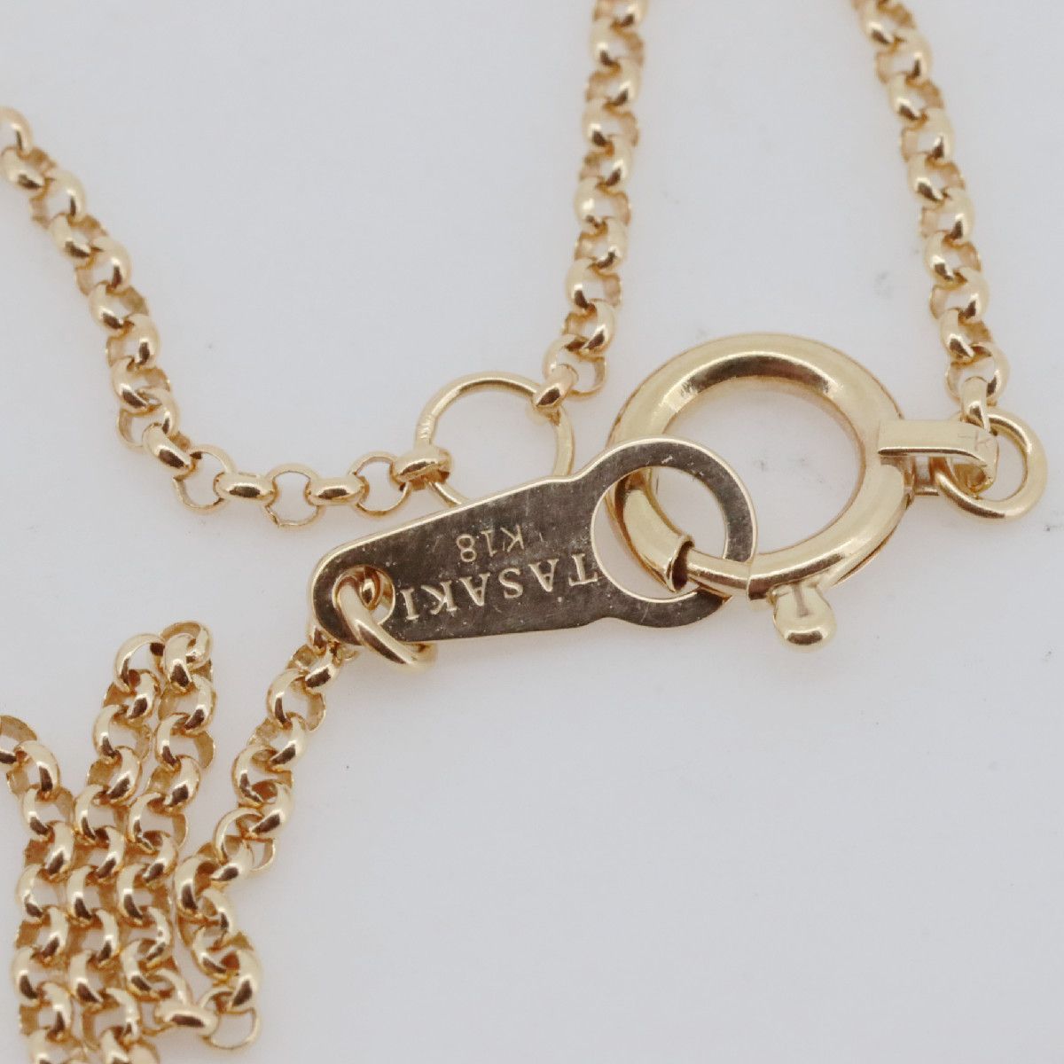 Tasaki Law gold necklace featuring an 8.8mm golden pearl and 0.12ct diamond on an 18K yellow gold chain
