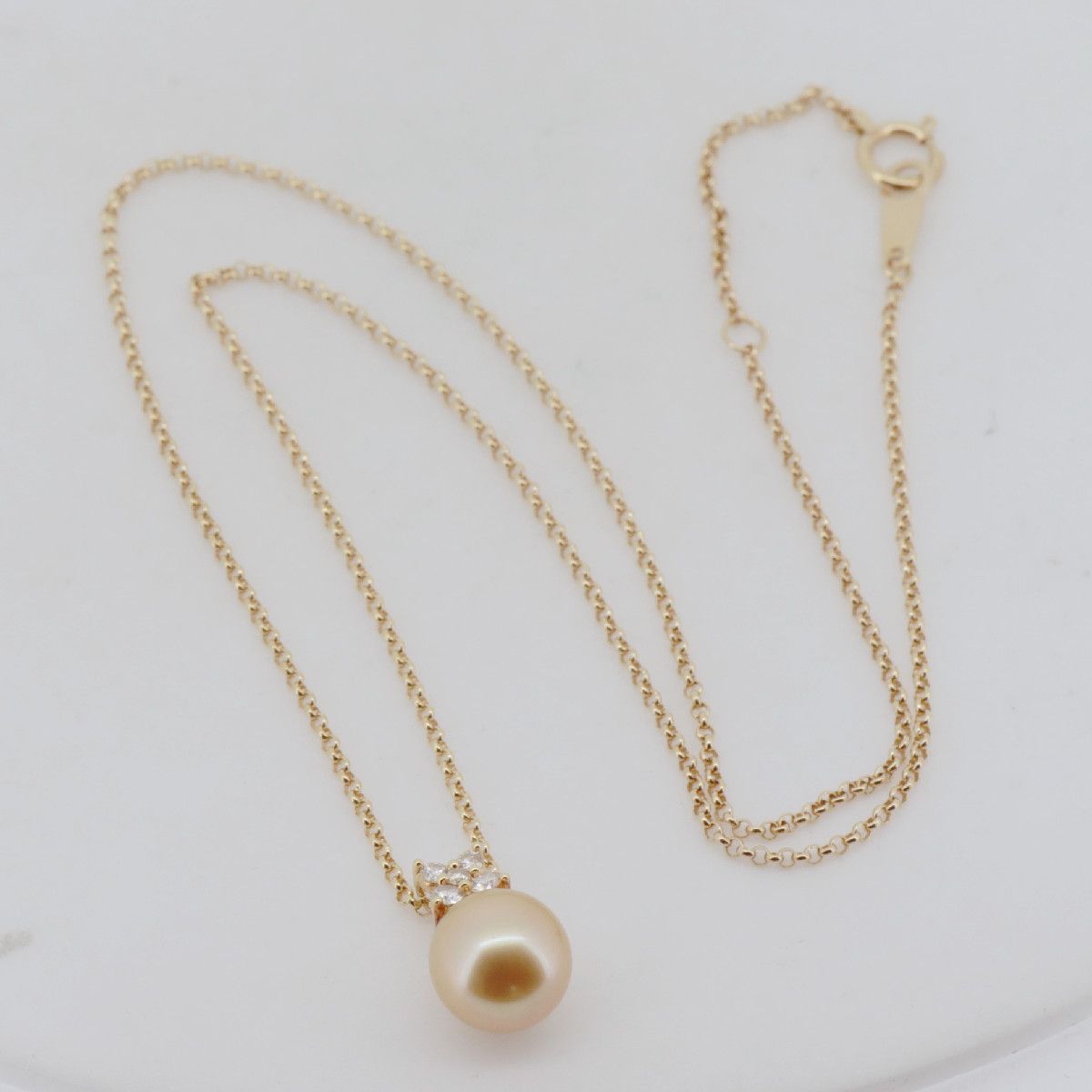 Tasaki Law gold necklace featuring an 8.8mm golden pearl and 0.12ct diamond on an 18K yellow gold chain