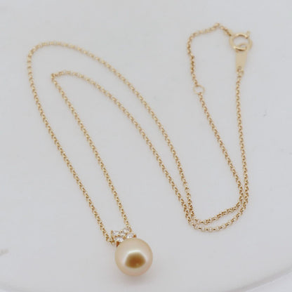 Tasaki Law gold necklace featuring an 8.8mm golden pearl and 0.12ct diamond on an 18K yellow gold chain