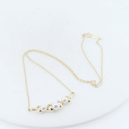 Mikimoto pearl necklace with 4.8mm to 5.9mm pearls set in 18K yellow gold chain