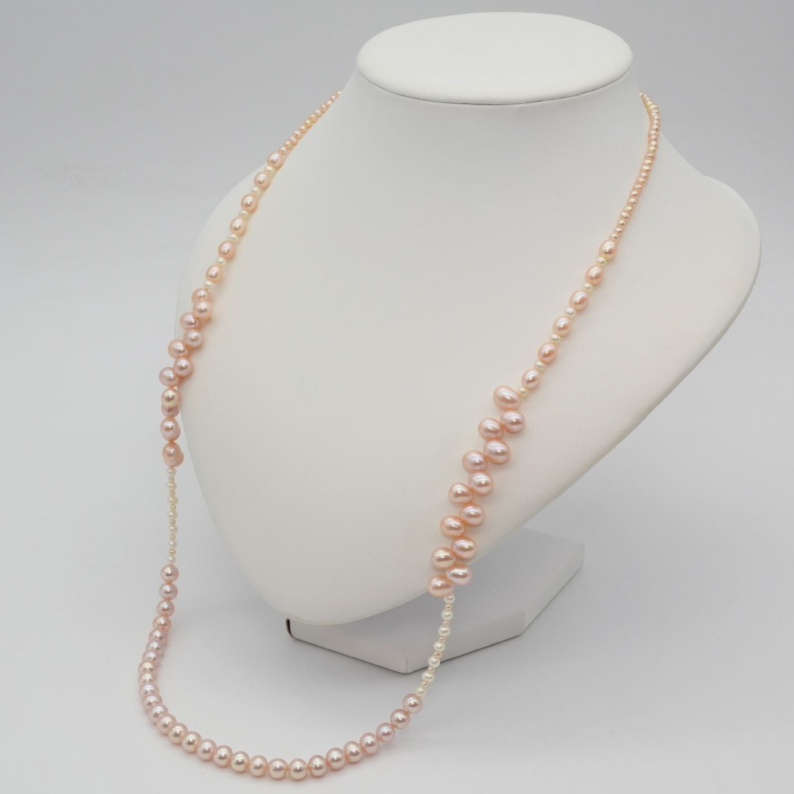 Agete K10 gold long necklace featuring pink freshwater pearls displayed on white background