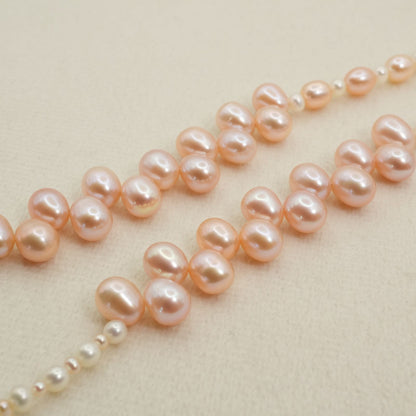 Agete K10 gold long necklace featuring pink freshwater pearls displayed on white background