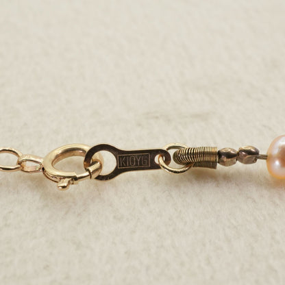 Agete K10 gold long necklace featuring pink freshwater pearls displayed on white background