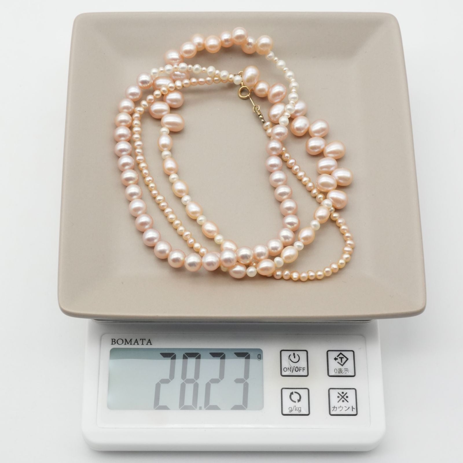 Agete K10 gold long necklace featuring pink freshwater pearls displayed on white background