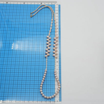 Agete K10 gold long necklace featuring pink freshwater pearls displayed on white background