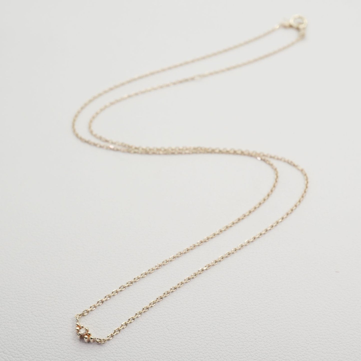 Agate K10 Diamond Necklace featuring polished K10 metal and sparkling diamonds on a delicate chain