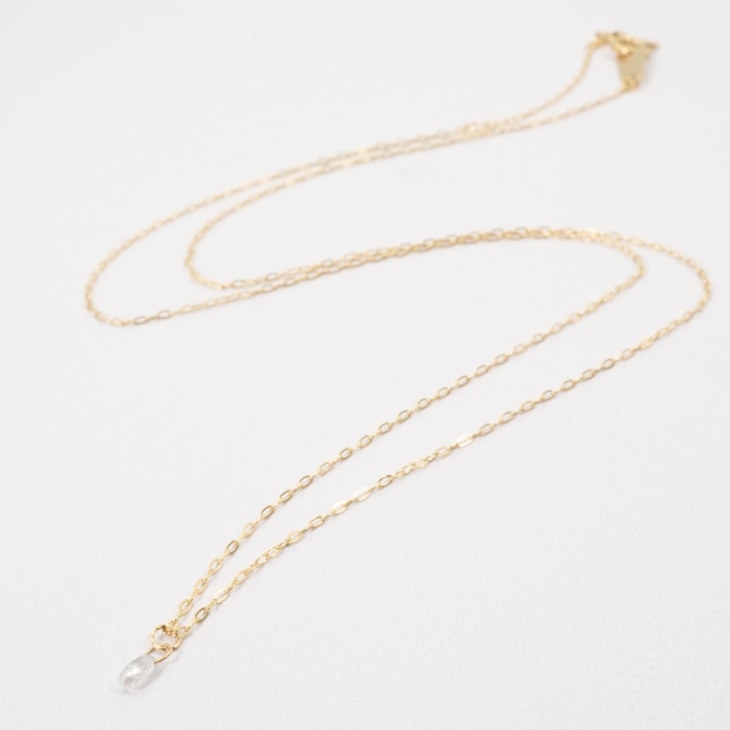 Agete K18 gold necklace with laser hole diamond pendant model 25-3160 displayed on white background