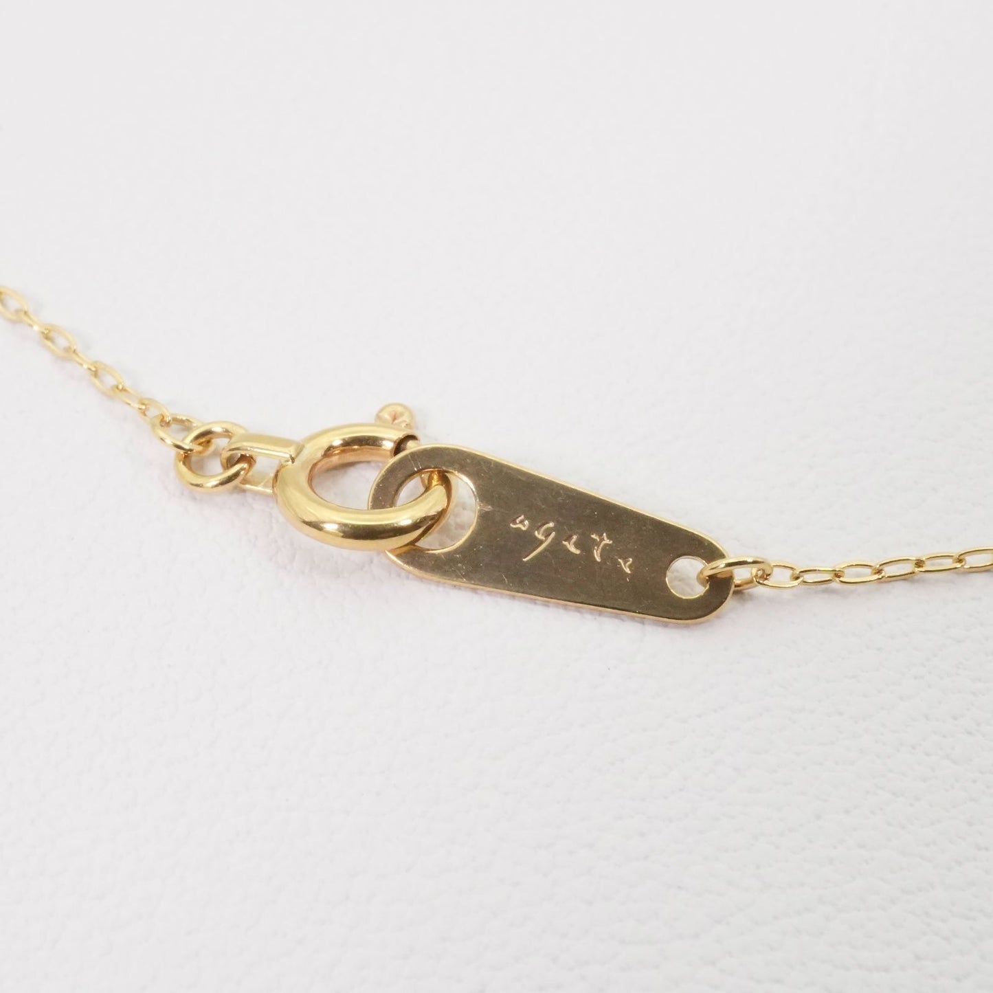 Agete K18 gold necklace with laser hole diamond pendant model 25-3160 displayed on white background