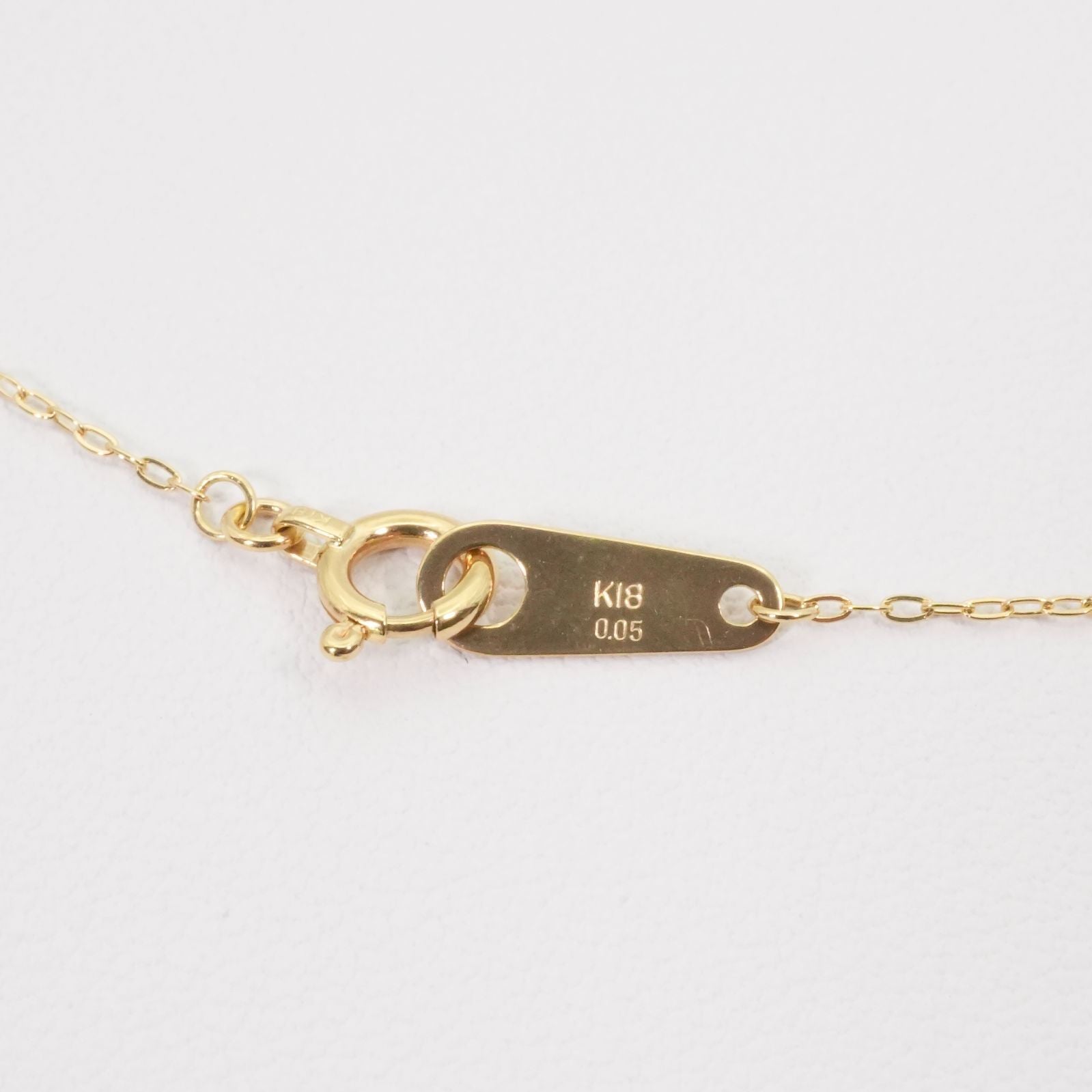 Agete K18 gold necklace with laser hole diamond pendant model 25-3160 displayed on white background