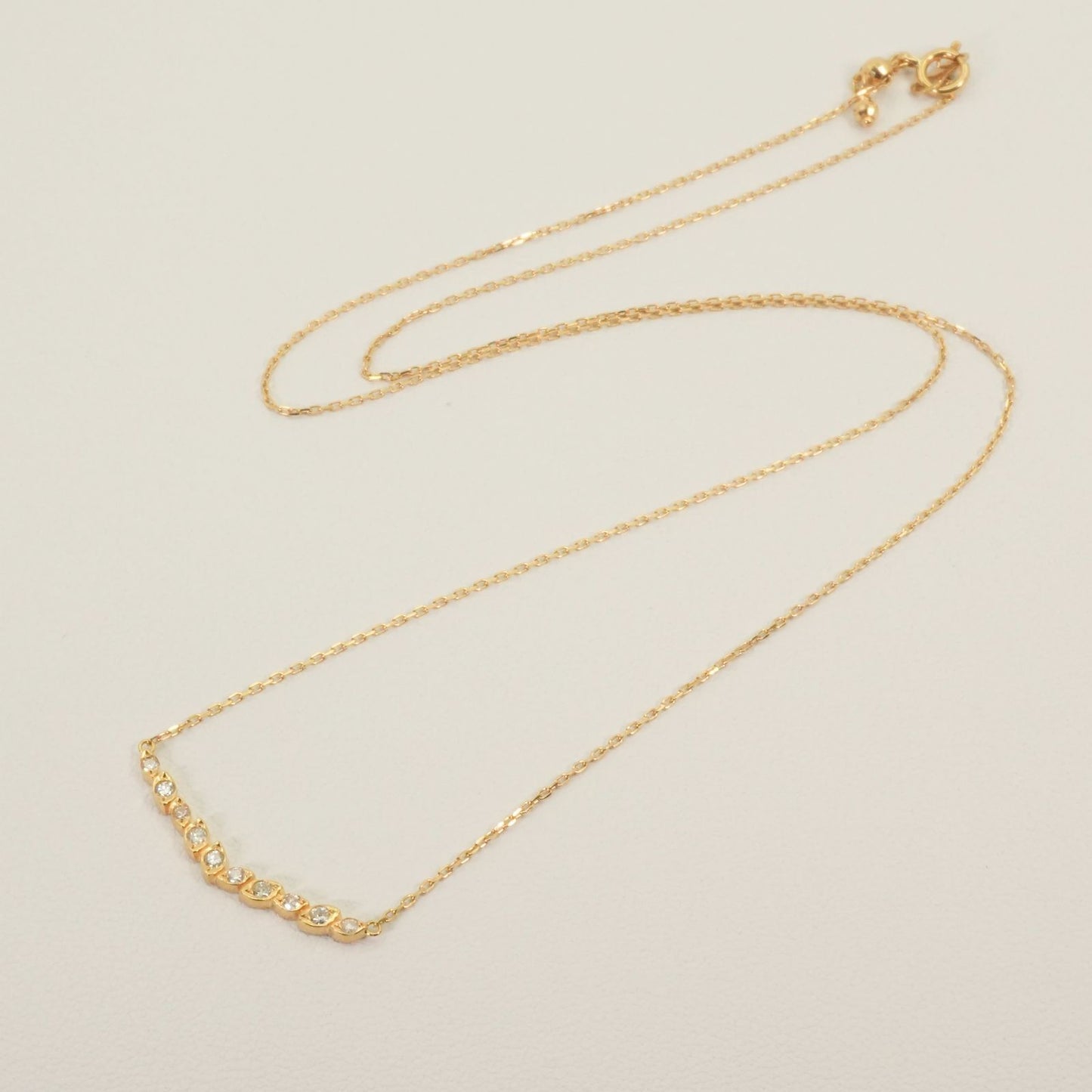 Agate K18 Diamond V Line Necklace 24-4403 with 0.12ct diamonds on a white background