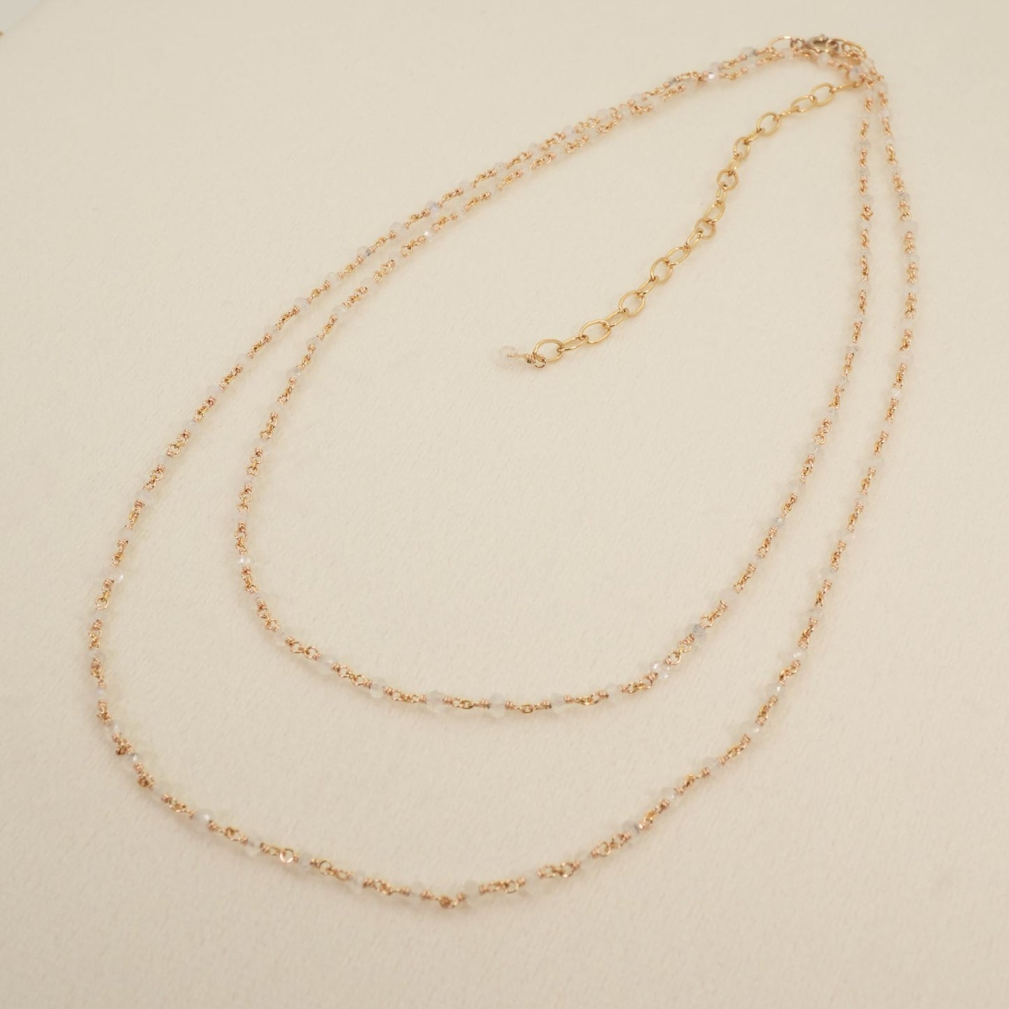 Agete long necklace made of silver with a labradorite stone pendant
