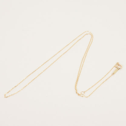 Agete K10 gold necklace chain laid out showing its fine links and polished finish