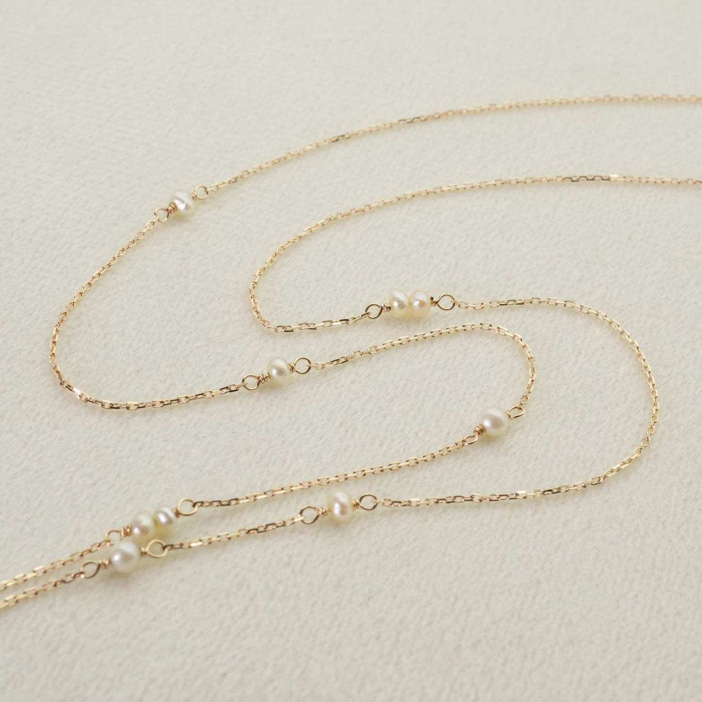 Agete Y-shaped long necklace made of K10 gold with freshwater pearls, clean and polished