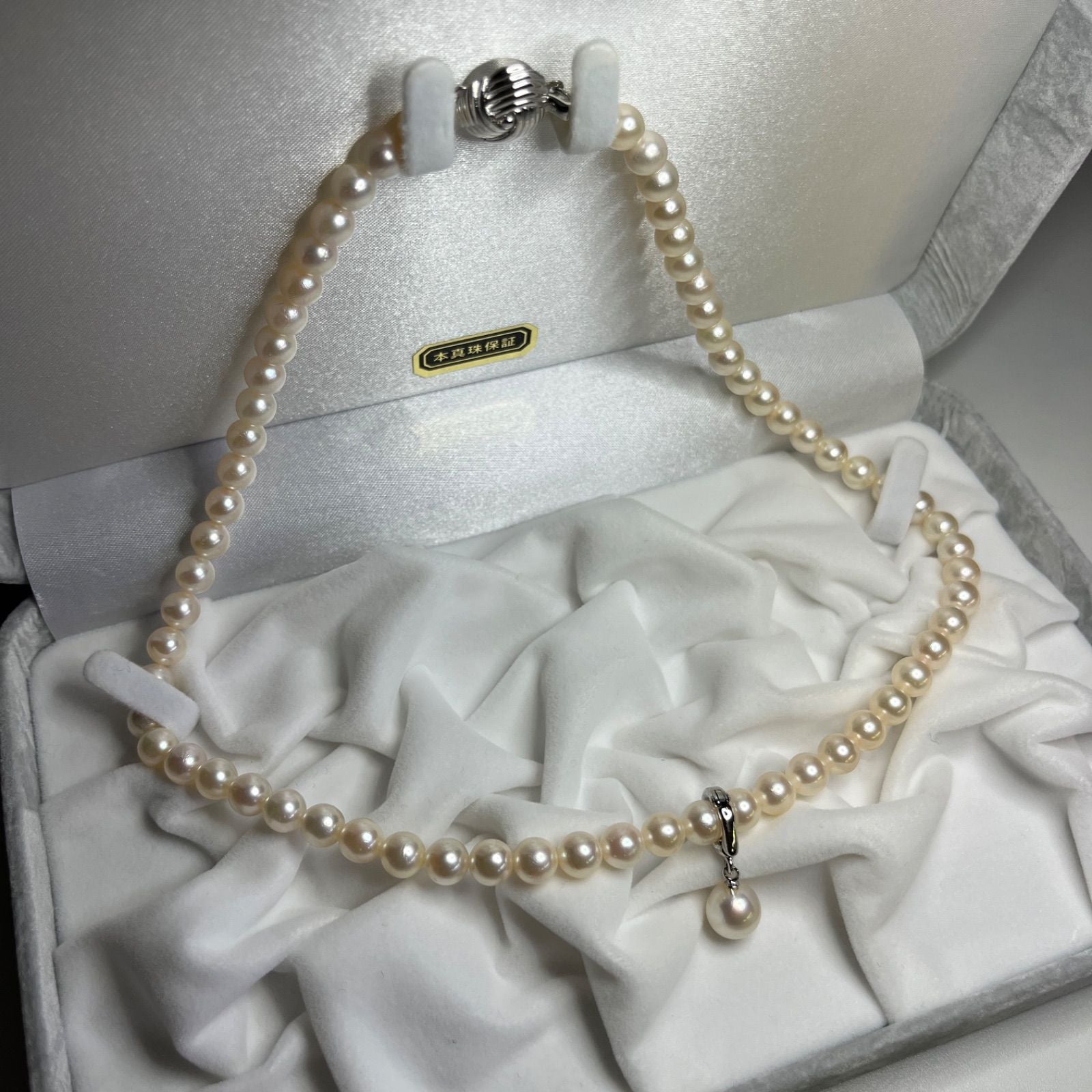 Akoya genuine pearl necklace with 6.0-6.5mm pearls and sterling silver fittings displayed with case