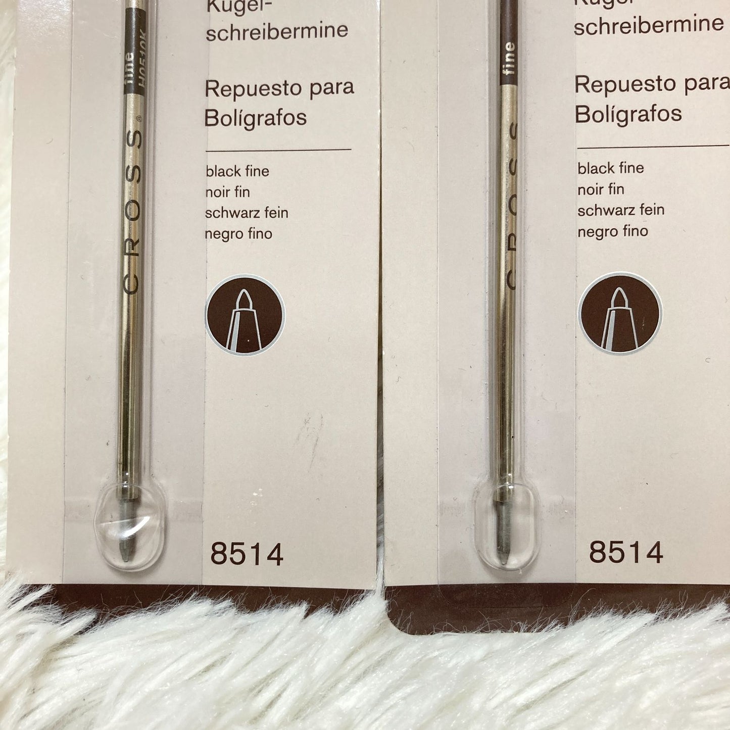 Set of seven CROSS Kuro ballpoint pen refills in black and brown with model numbers 8513 and 8514