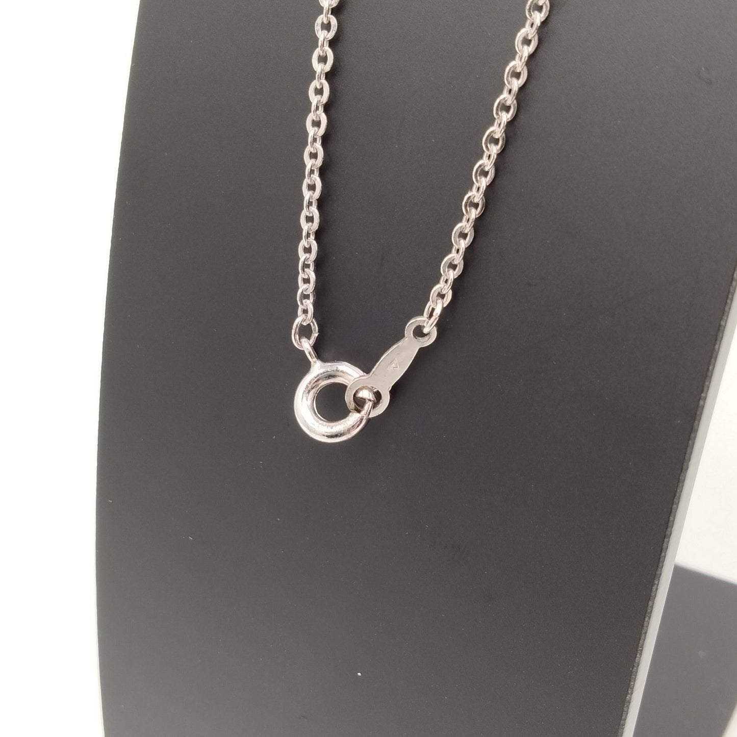 MIKIMOTO silver heart necklace with a 0.5cm pearl pendant and 19cm chain on white background