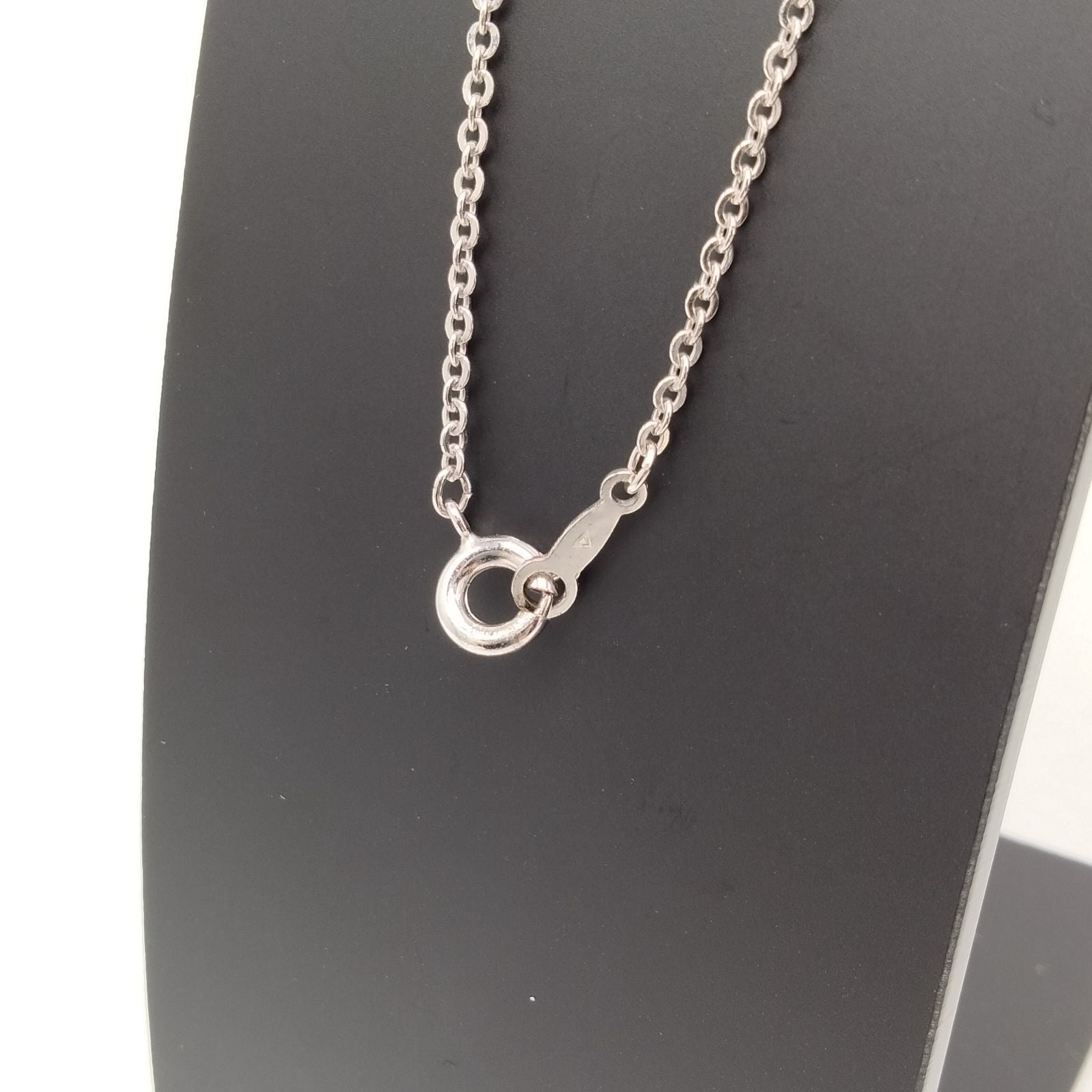 MIKIMOTO silver heart necklace with a 0.5cm pearl pendant and 19cm chain on white background