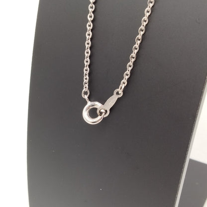 MIKIMOTO silver heart necklace with a 0.5cm pearl pendant and 19cm chain on white background