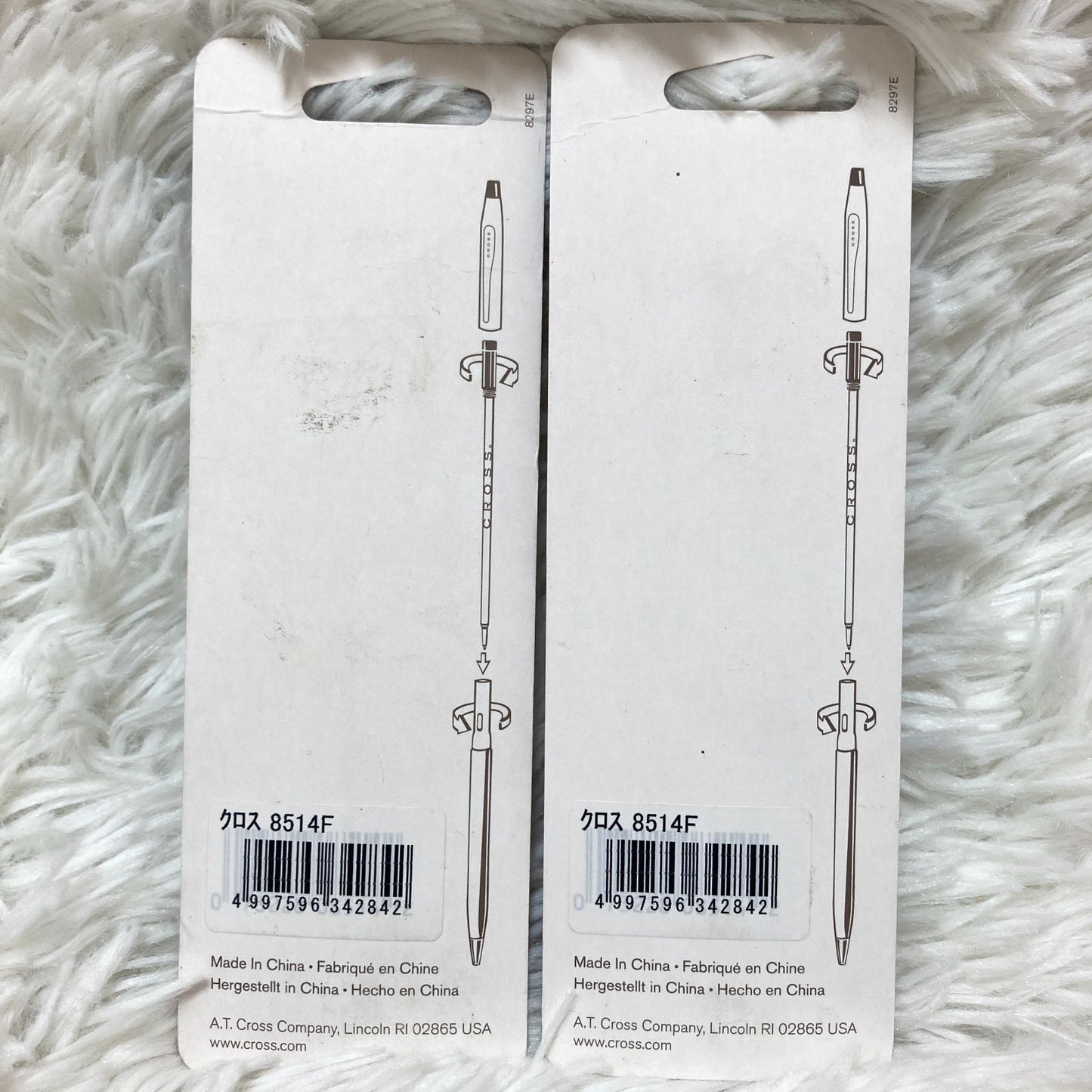 Set of seven CROSS Kuro ballpoint pen refills in black and brown with model numbers 8513 and 8514