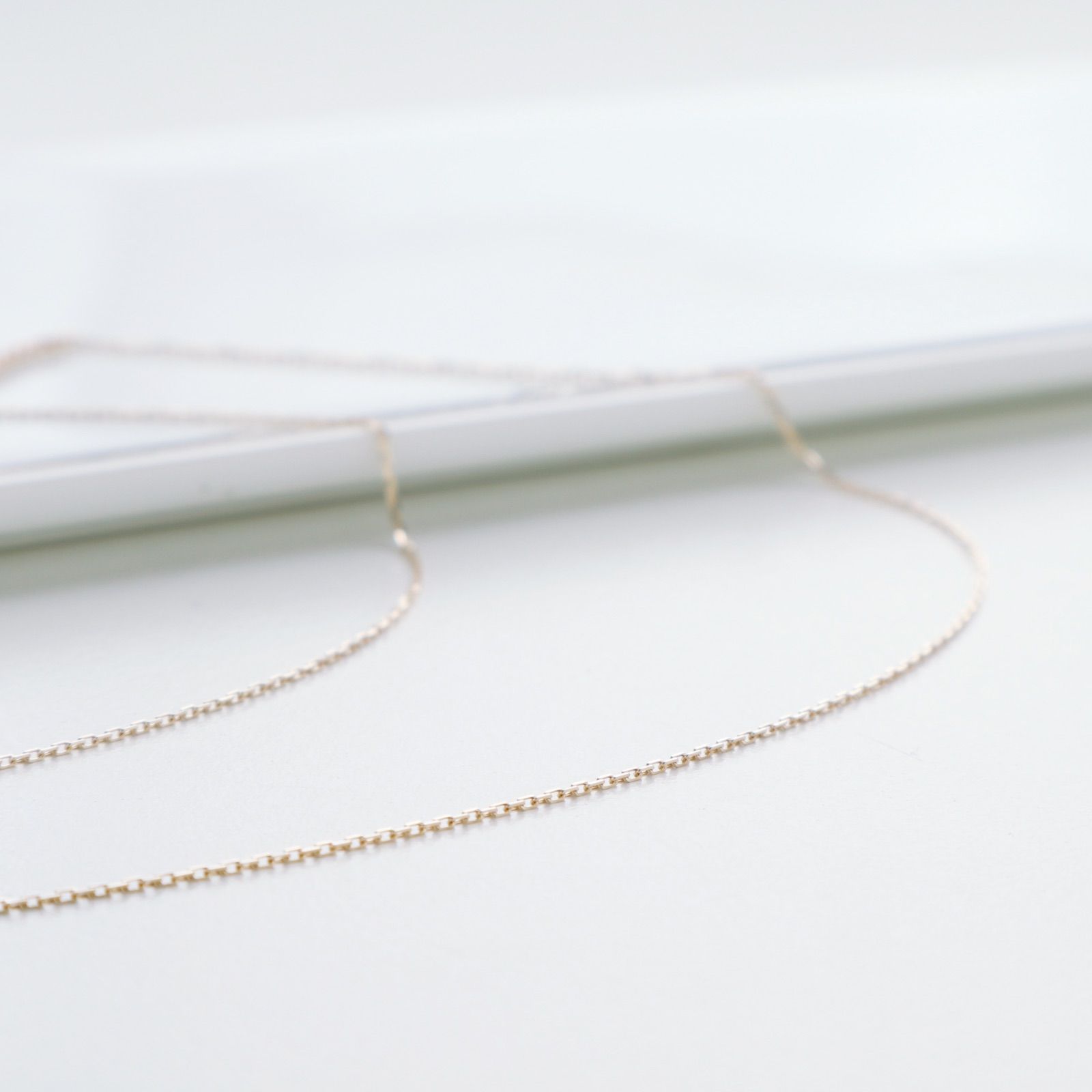 Agete K10 gold necklace featuring a 0.06ct diamond charm with 36cm chain from the early 2000s