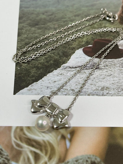 Mikimoto silver necklace with 6.5mm pearls weighing 3.5g, 38cm length
