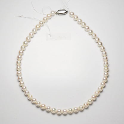 Akoya pearl necklace with 7.5-8mm pearls measuring 42cm in length on a white background