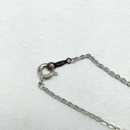 MIKIMOTO silver heart necklace with a 0.5cm pearl pendant and 19cm chain on white background