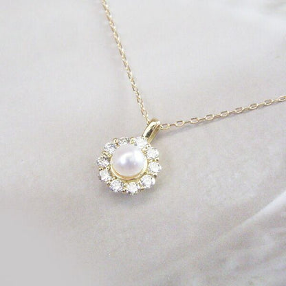 18K gold necklace with 3mm baby Akoya pearl and 10 small diamonds on a delicate chain model tc-0129