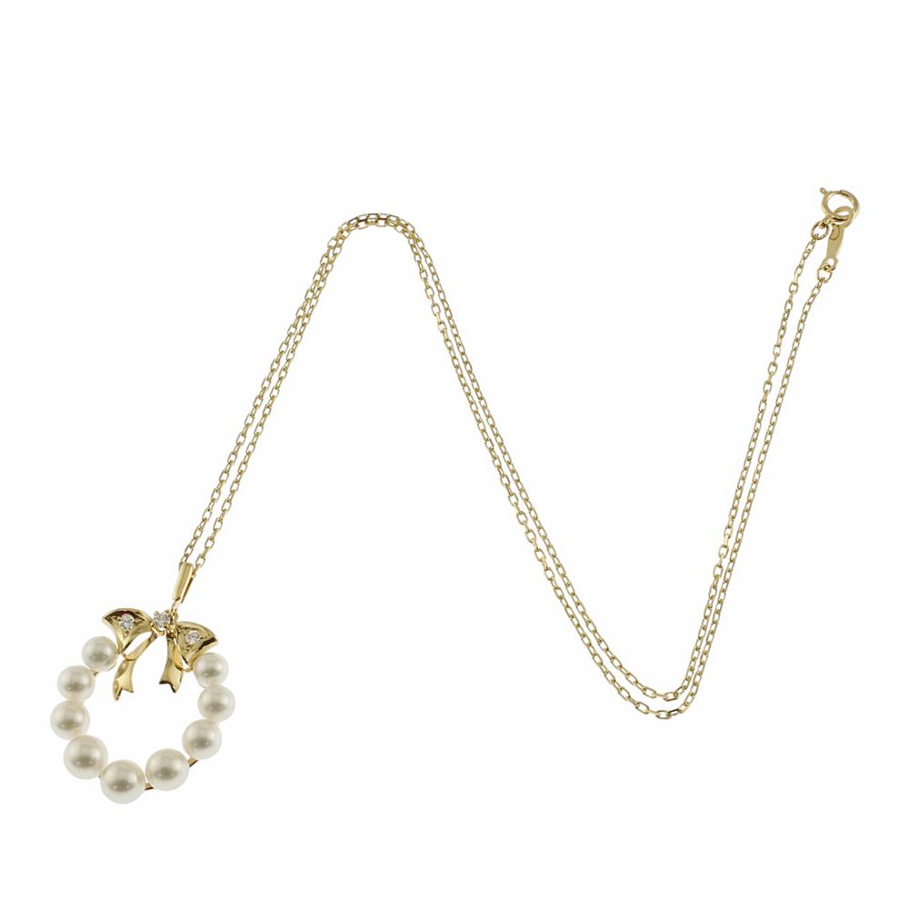 Mikimoto 18K yellow gold necklace featuring a single Akoya pearl and diamond accents for ladies