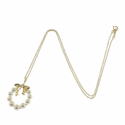 Mikimoto 18K yellow gold necklace featuring a single Akoya pearl and diamond accents for ladies