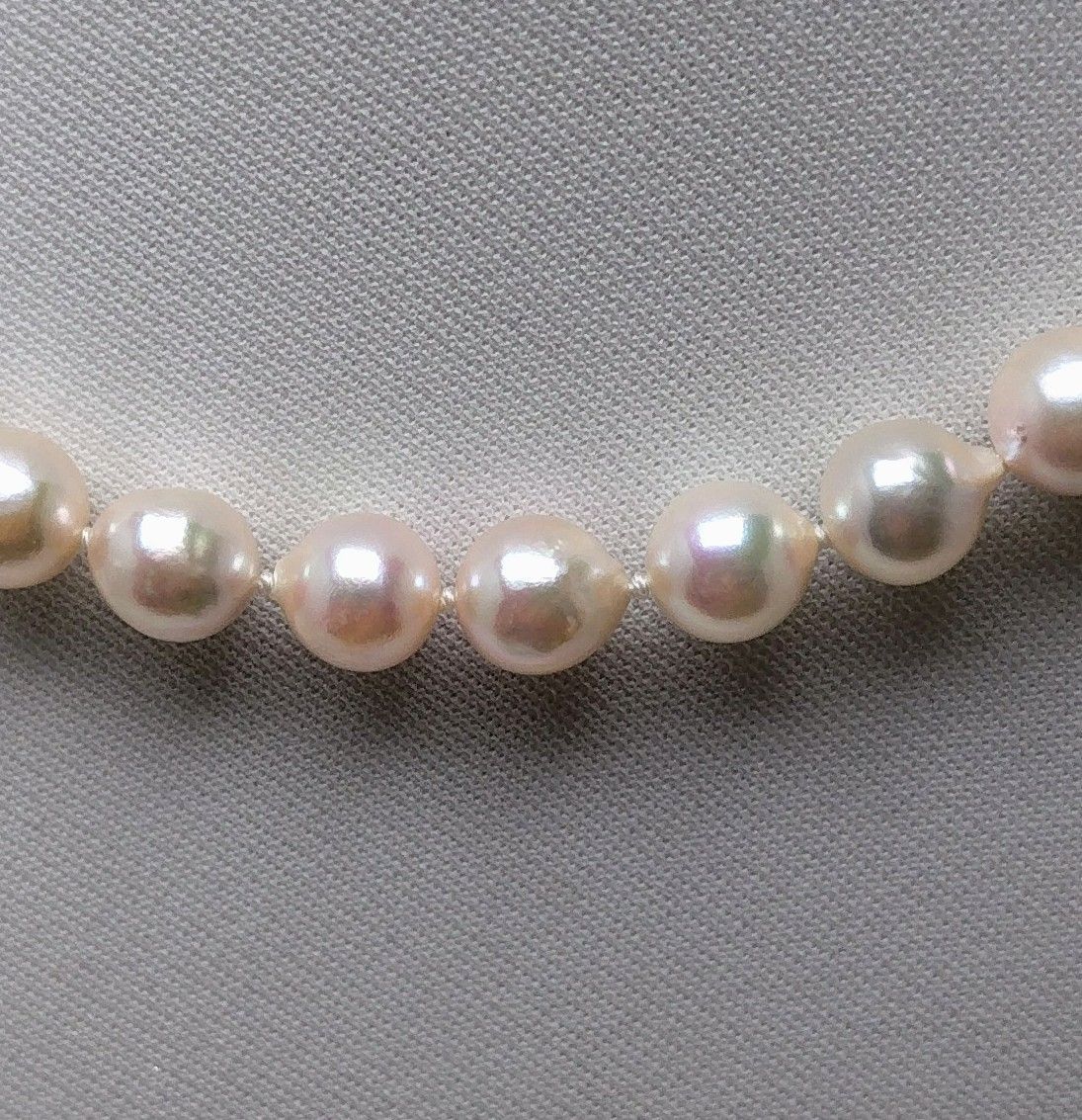 Akoya pearl necklace featuring 9.0-8.5mm white pink semi baroque pearls with unique indentations and good luster
