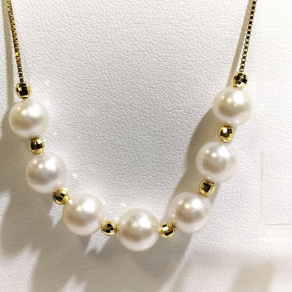 Akoya pearl necklace with 7-7.5 mm pearls and matching 7.5 mm pearl earrings on white background