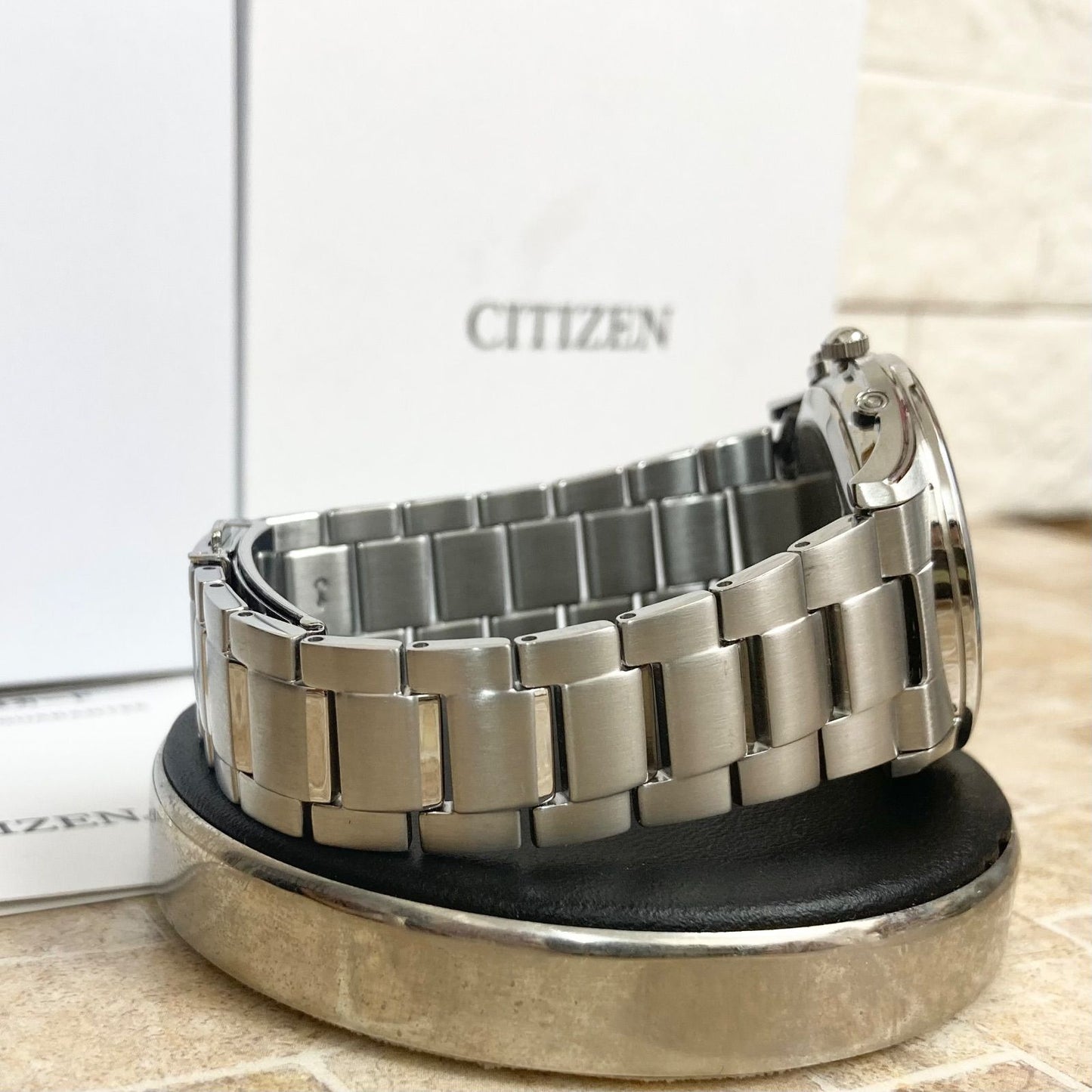 Citizen Eco-Drive men's radio-controlled watch model H415-S112907 with silver case and black band