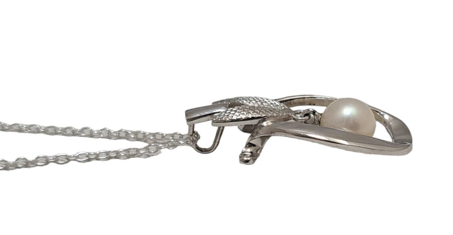 Mikimoto pearl pendant head with 6.5mm pearl on SV925 silver setting measuring 1.5x3 cm displayed on white background