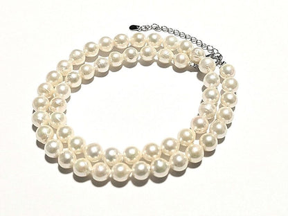 Akoya pearl necklace with 7.0mm-7.5mm white round to semi-round pearls and stainless steel push clasp