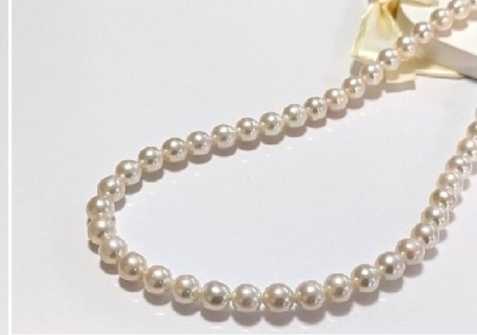 Akoya pearl necklace with 7.0mm-7.5mm white round to semi-round pearls and stainless steel push clasp