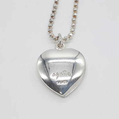 Agete heart-shaped silver necklace with heart rocket and clover charm on silver chain