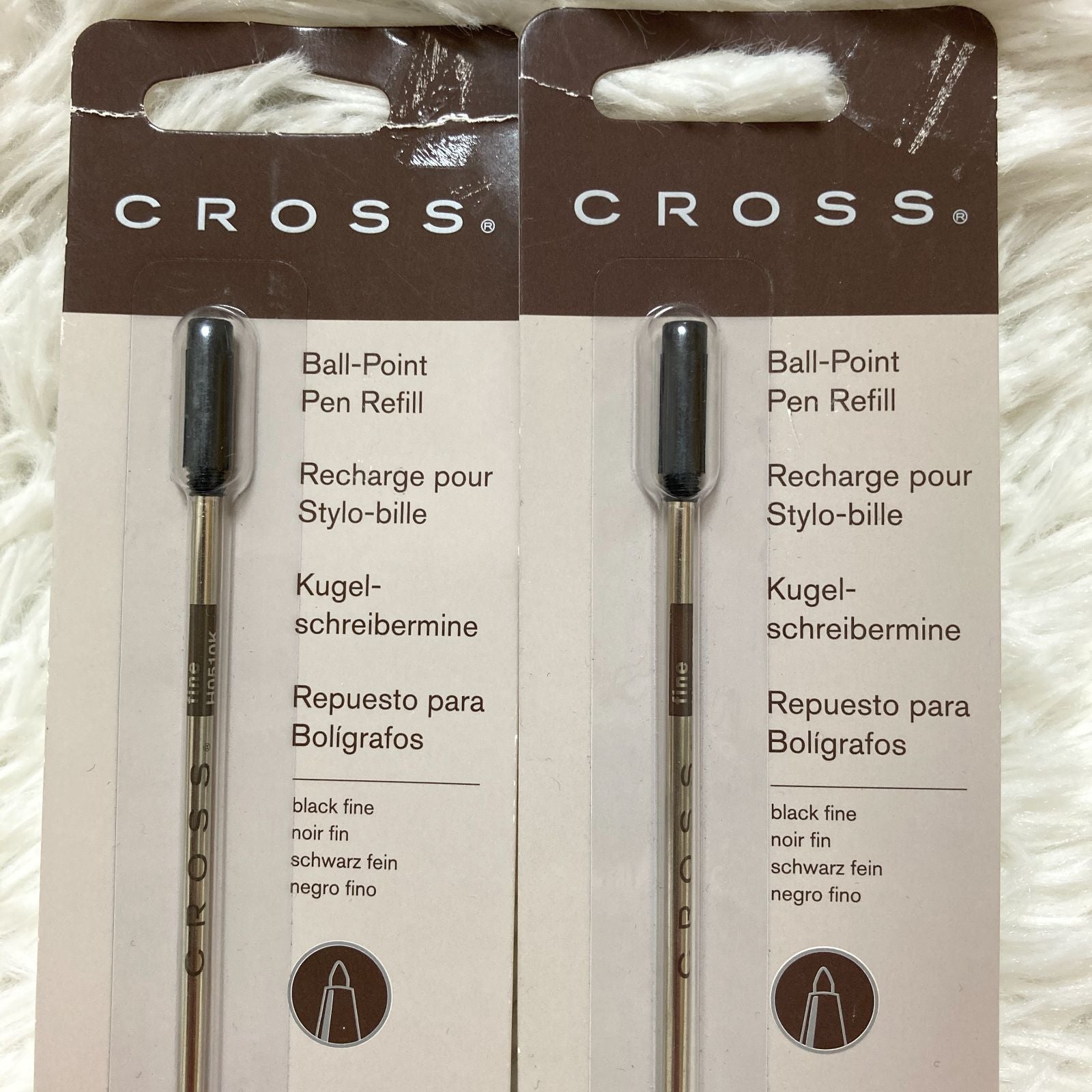 Set of seven CROSS Kuro ballpoint pen refills in black and brown with model numbers 8513 and 8514