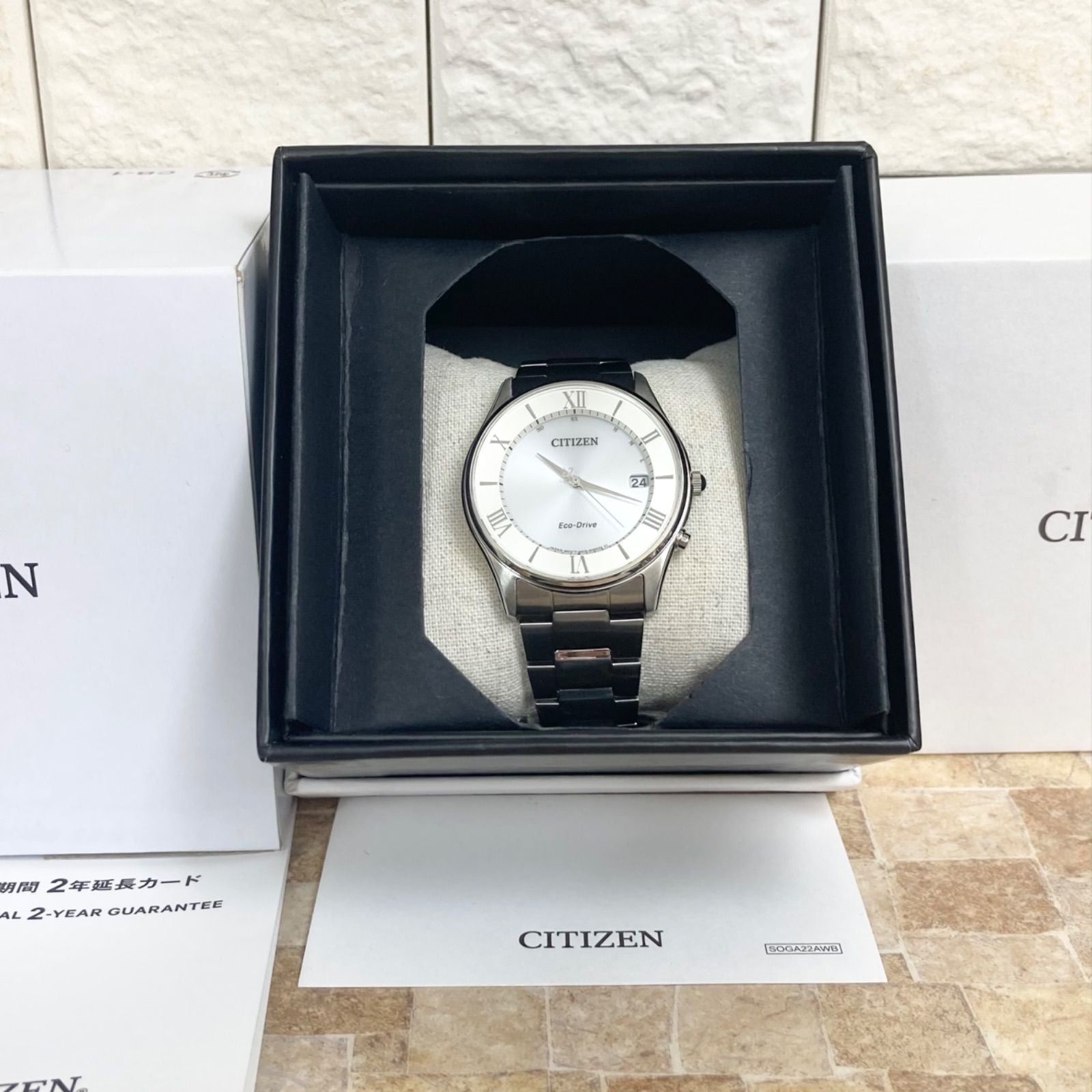 Citizen Eco-Drive men's radio-controlled watch model H415-S112907 with silver case and black band