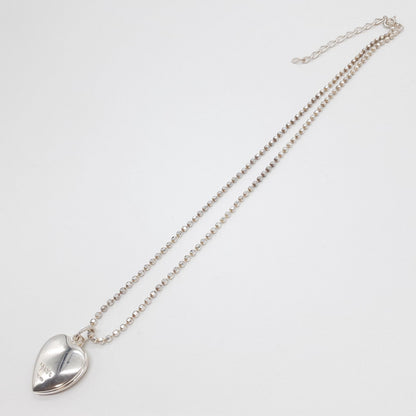 Agete heart-shaped silver necklace with heart rocket and clover charm on silver chain