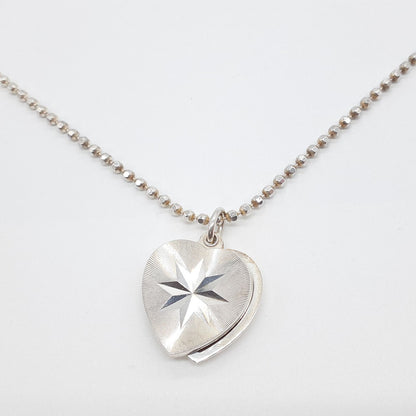 Agete heart-shaped silver necklace with heart rocket and clover charm on silver chain